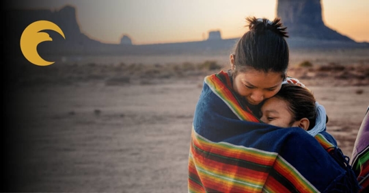 Native American mother and child hugging