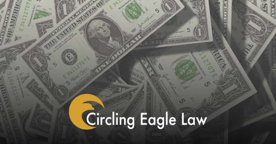 money and circling eagle logo