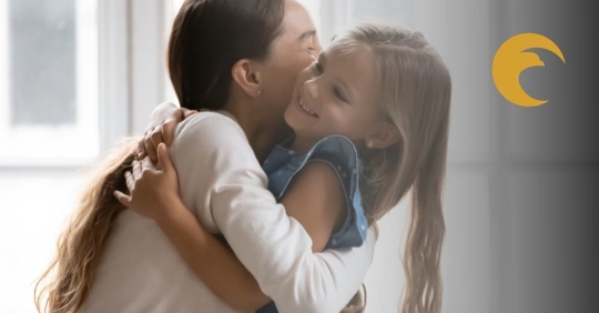 Mom and daughter hugging.