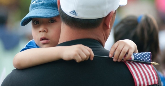 Child holding American flag