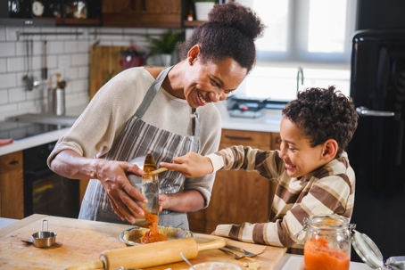 mother and child making pumpkin pie